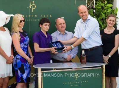 Duncan and Wee Mouse collecting The Musketeer's winning prize at Hamilton