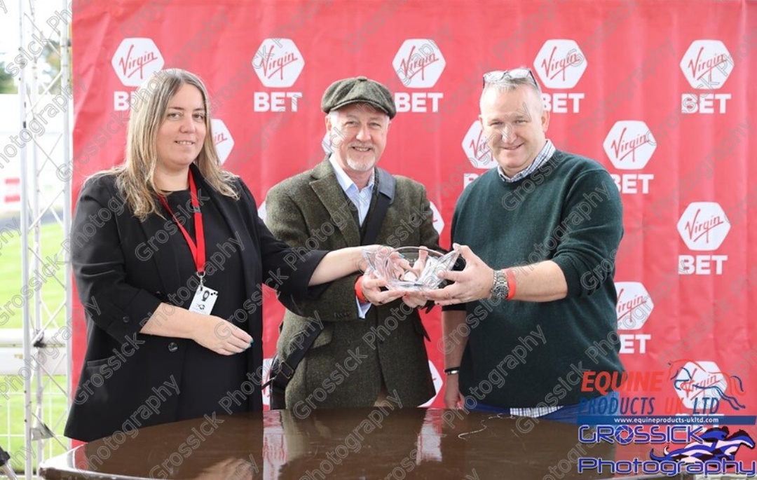 Richie and Dave collecting the prize